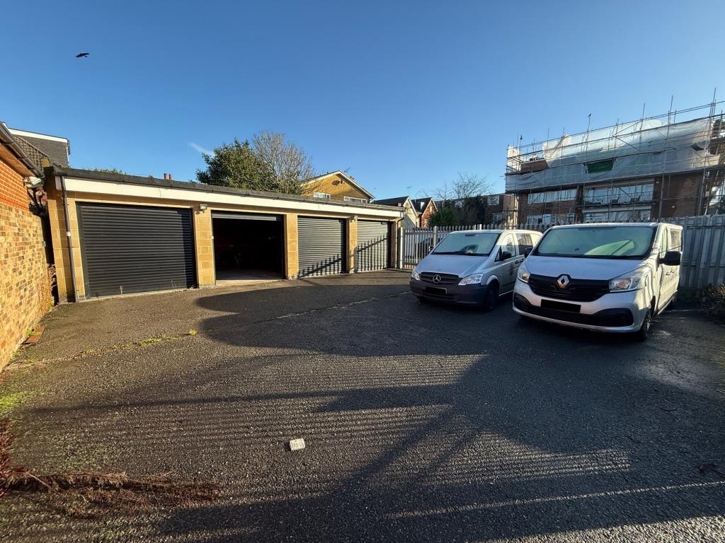 Lot: 78 - GARAGES AND FORECOURT WITH POTENTIAL - Garages and forecourt taken from just inside the gates